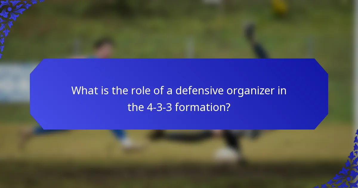 What is the role of a defensive organizer in the 4-3-3 formation?